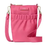 A pink crossbody bag with a zip closure and adjustable strap, featuring the Kate Spade logo on the front.