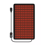 A rectangular LED red light therapy pad with a power cord and remote control for settings adjustment, used for potential therapeutic purposes.