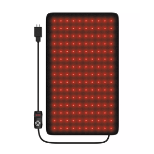 A rectangular LED red light therapy pad with a power cord and remote control for settings adjustment, used for potential therapeutic purposes.
