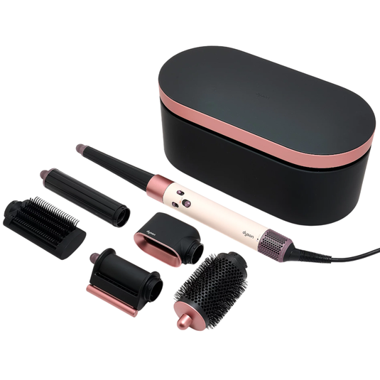 Dyson hair styling tool set includes a main device and multiple attachments for curling, smoothing, and volumizing. The set comes in a black and rose gold design with a storage case.