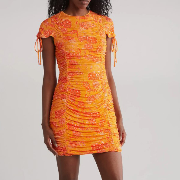 A short, ruched orange dress with a patterned design and drawstring details on the sleeves.