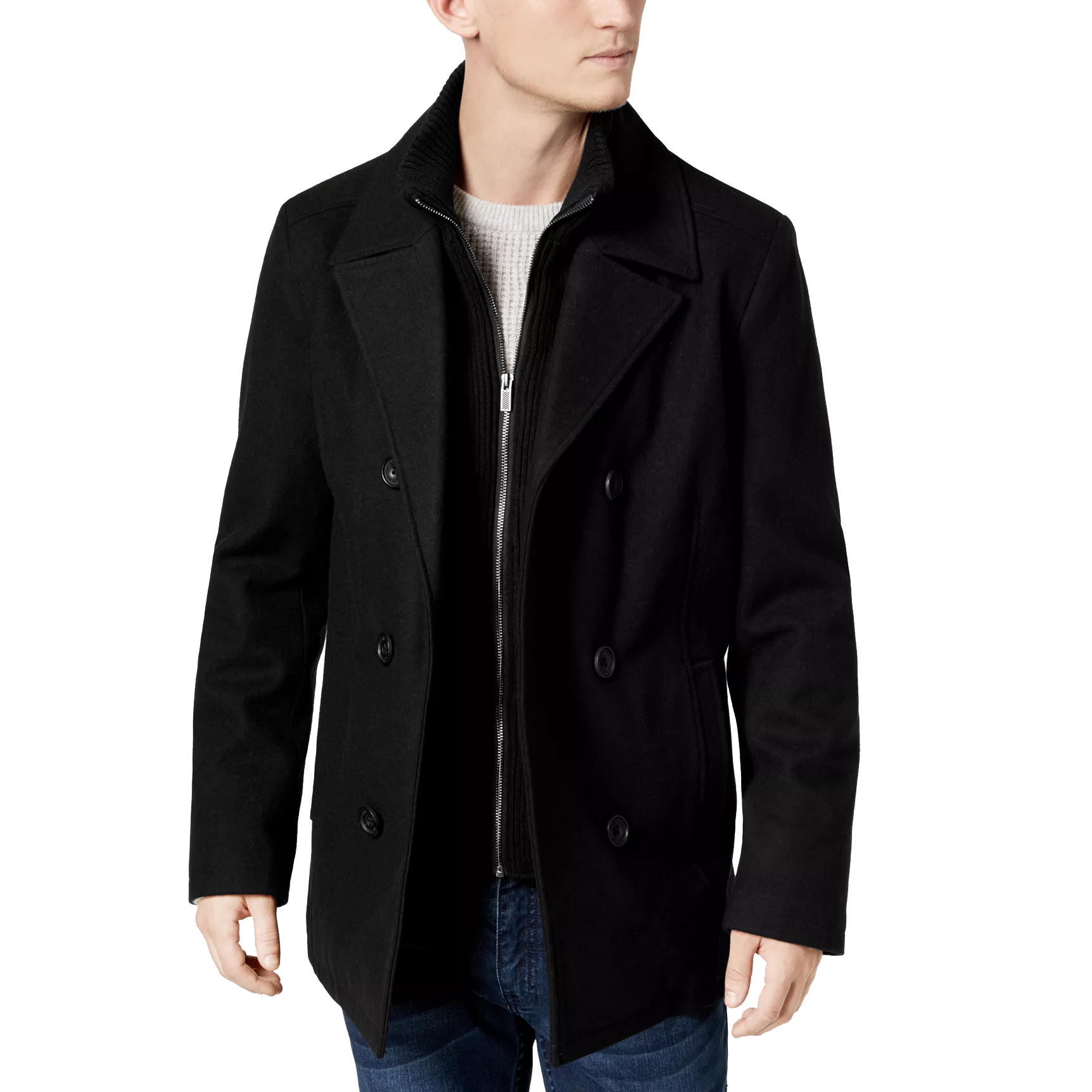 A man is wearing a classic black double-breasted pea coat over a textured sweater, paired with jeans.