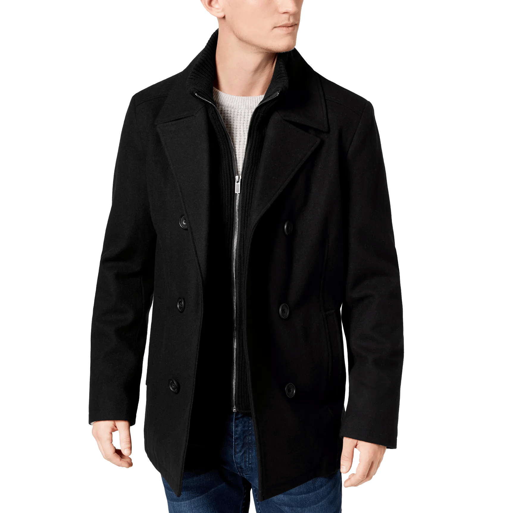 A man is wearing a classic black double-breasted pea coat over a textured sweater, paired with jeans.