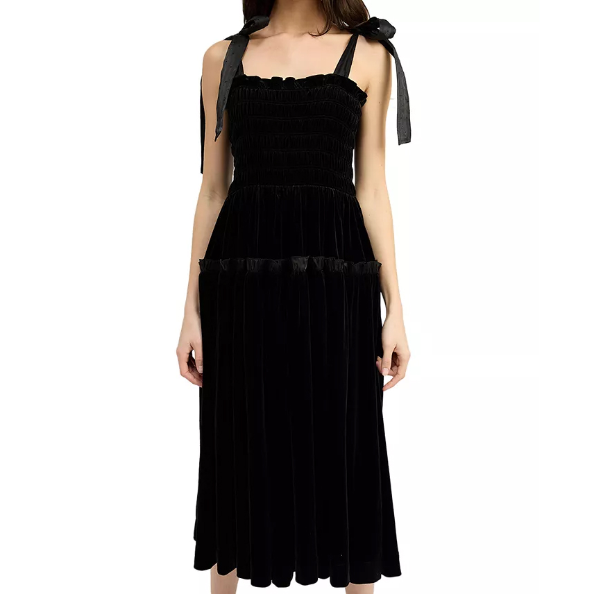 Black velvet midi dress with a smocked bodice and tie-shoulder straps. The dress features a fitted bodice and a semi-full skirt with a tiered design.