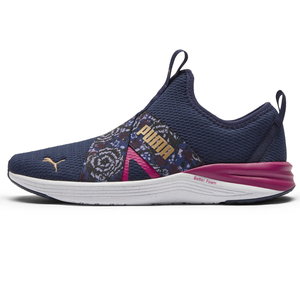Dark navy Puma women's sneakers with pink accents, a slip-on style, and a floral pattern on the elastic cross strap.