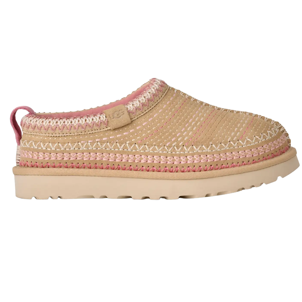 A tan and pink slip-on shoe with braided detailing, featuring a pull tab at the back and a textured rubber sole.