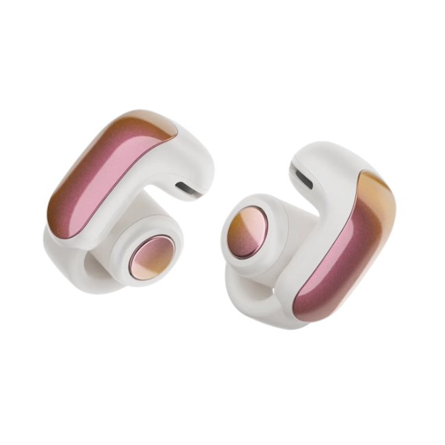 Bose Ultra Open Earbuds feature a sleek design with a white base and shimmering pink accents, providing a comfortable and stylish audio experience.