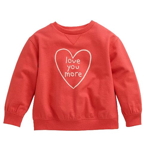 Red sweatshirt with a heart design and the text \“love you more\“ inside.
