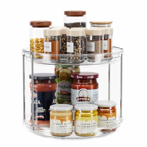 A rotating organizer with two tiers, containing various jars of spices, sauces, and condiments, including peanut butter sauce and lemon curd ice cream topping, designed for efficient storage and easy access.