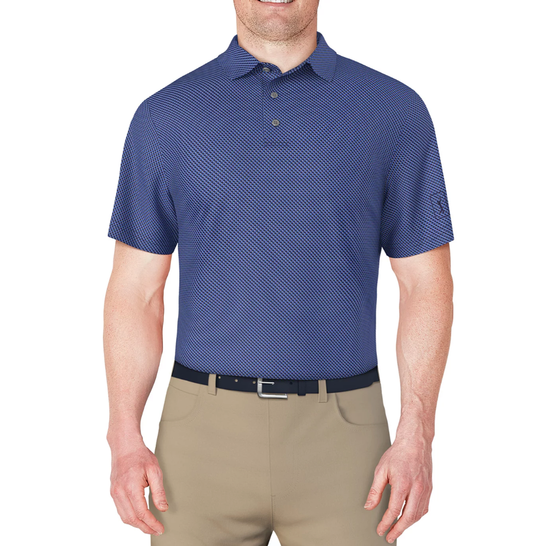 A man is wearing a blue patterned polo shirt with a collar and buttons, paired with beige pants and a black belt.