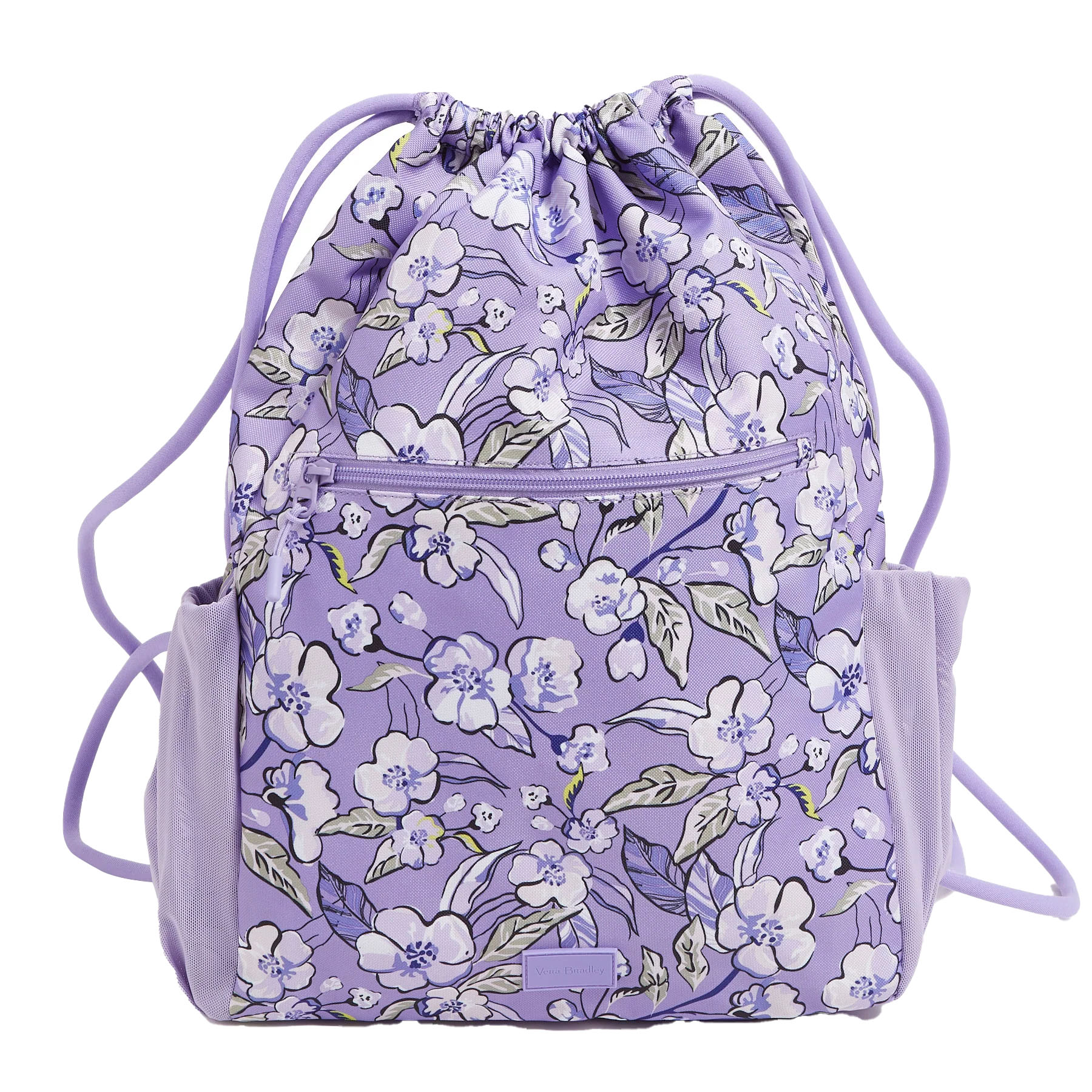 A purple Vera Bradley Drawstring Backpack features a floral pattern with white and blue flowers, a front zipper pocket, side pockets, and matching purple drawstrings.