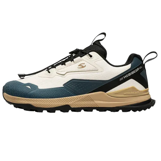 Hiking shoe with a white, blue, and tan color scheme, featuring a rugged sole and black lace-up closure.