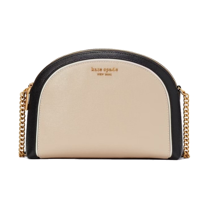 A half-moon shaped Kate Spade New York leather crossbody bag with a beige front, black trim, and a gold-tone chain strap.
