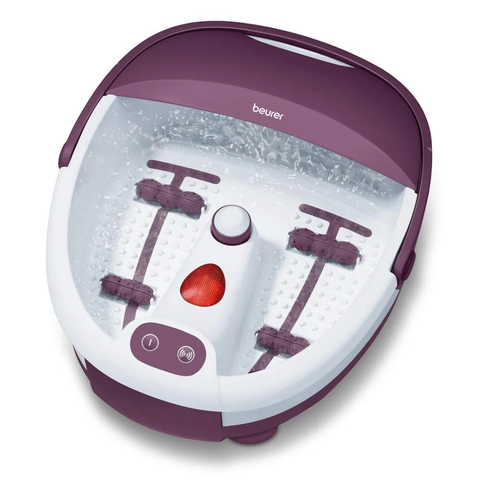 Beurer Bubble Foot Bath Spa with purple and white design features massage rollers, bubble jets, and a heating function, offering a relaxing foot massage experience.