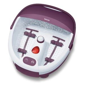 Beurer Bubble Foot Bath Spa with purple and white design features massage rollers, bubble jets, and a heating function, offering a relaxing foot massage experience.