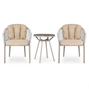 A 3-piece conversation bistro set featuring two beige-cushioned chairs with a woven design and a small round metal table with a stable, sleek base.
