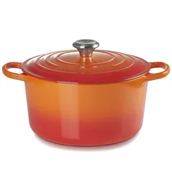 A round, orange-red gradient cast iron Dutch oven with a silver knob on the lid and two handles.