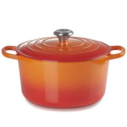 A round, orange-red gradient cast iron Dutch oven with a silver knob on the lid and two handles.