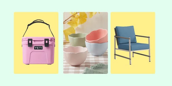 A pink cooler, pastel-colored bowls, and a blue outdoor chair on a green background.