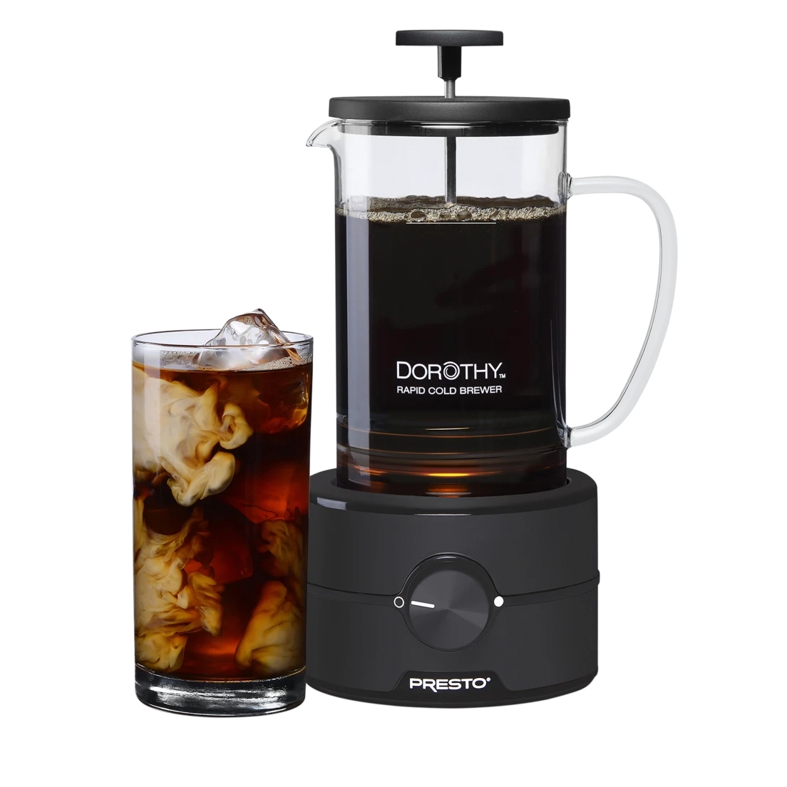 22oz rapid cold brew coffee maker with a clear glass carafe and black base, accompanied by a glass of iced coffee with cream swirling in it.