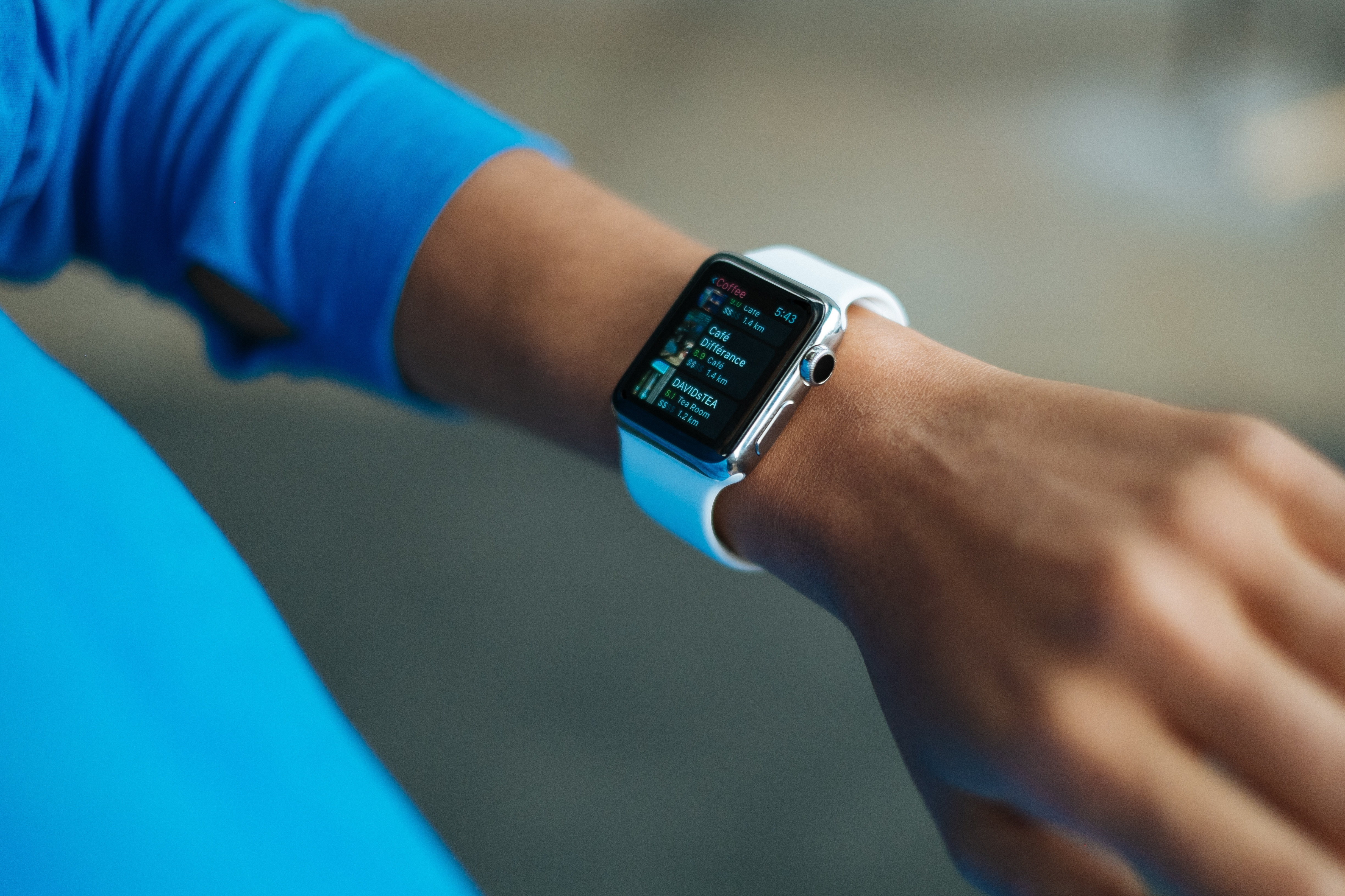 A smartwatch displaying a fitness app on someone's wrist.
