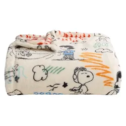 A soft fleece blanket featuring Snoopy and other Peanuts characters, with colorful doodles and patterns on a white background.