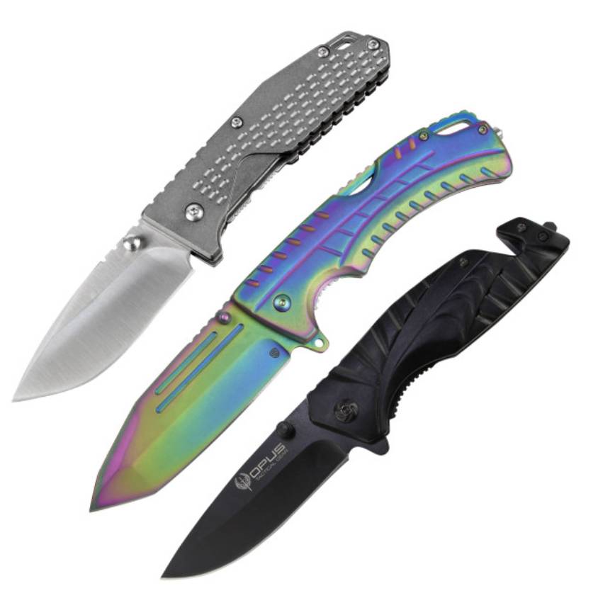 Set of three folding knives: one with a brushed silver finish, another with a rainbow metallic finish, and a third with a black matte finish. Each knife features a unique grip design and a compact, practical blade shape.