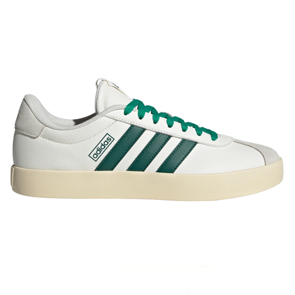 Adidas sneaker featuring a white upper, green stripes, and a beige sole, with green laces and the Adidas logo on the side.