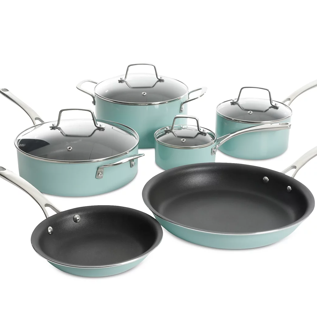 The 10pc Martha Stewart Nonstick Cook Set includes a variety of cookware in a light blue color with nonstick interiors and glass lids. The set features two frying pans, a sauté pan, a stockpot, and two saucepans, all with stainless steel handles.
