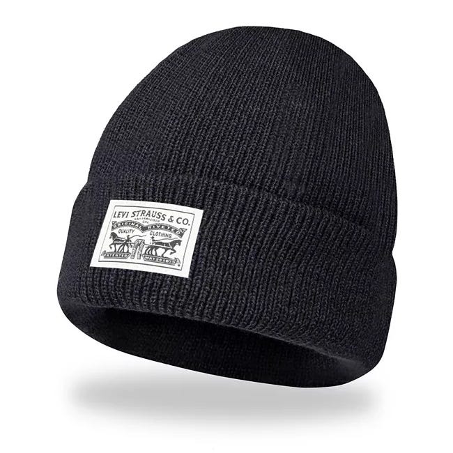 A black knit beanie with a folded brim featuring a white logo patch from Levi Strauss & Co., displaying their traditional branding.