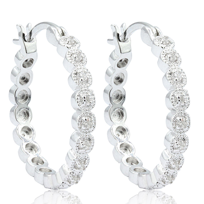 Silver hoop earrings embellished with round, sparkling stones.