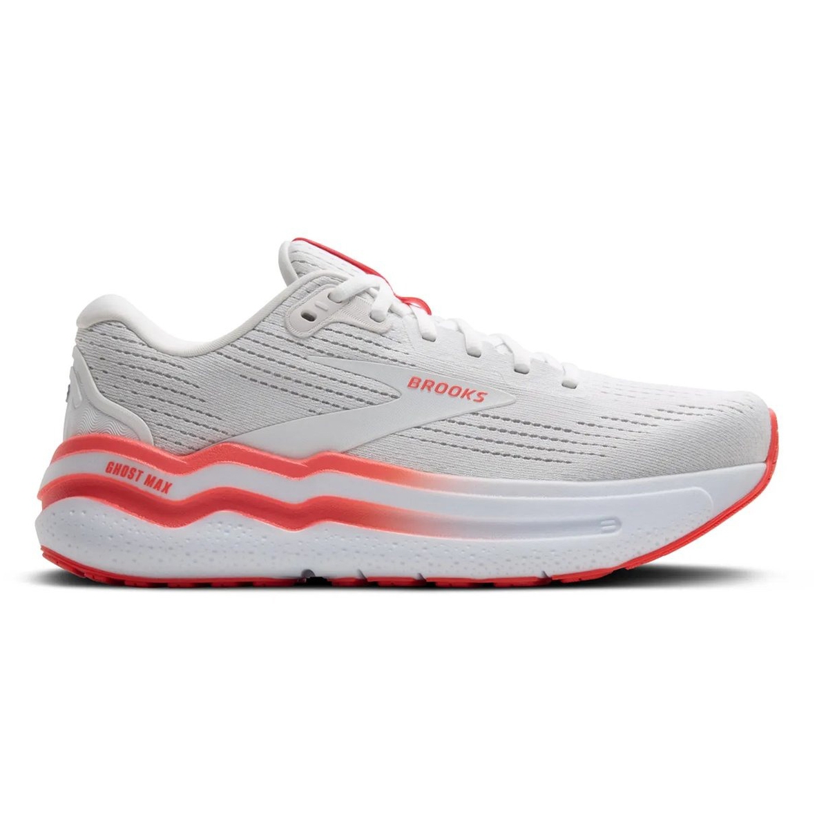 White Brooks Ghost Max running shoe with red accents, featuring a cushioned sole and textured upper design.