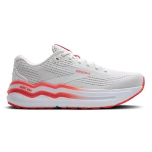 White Brooks Ghost Max running shoe with red accents, featuring a cushioned sole and textured upper design.