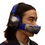 Over-ear headphones with an integrated visor-like air filter attachment covering the mouth, designed for simultaneous audio listening and air purification.
