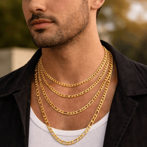A man wears multiple gold chain necklaces of varying lengths with a white tank top and a dark jacket.