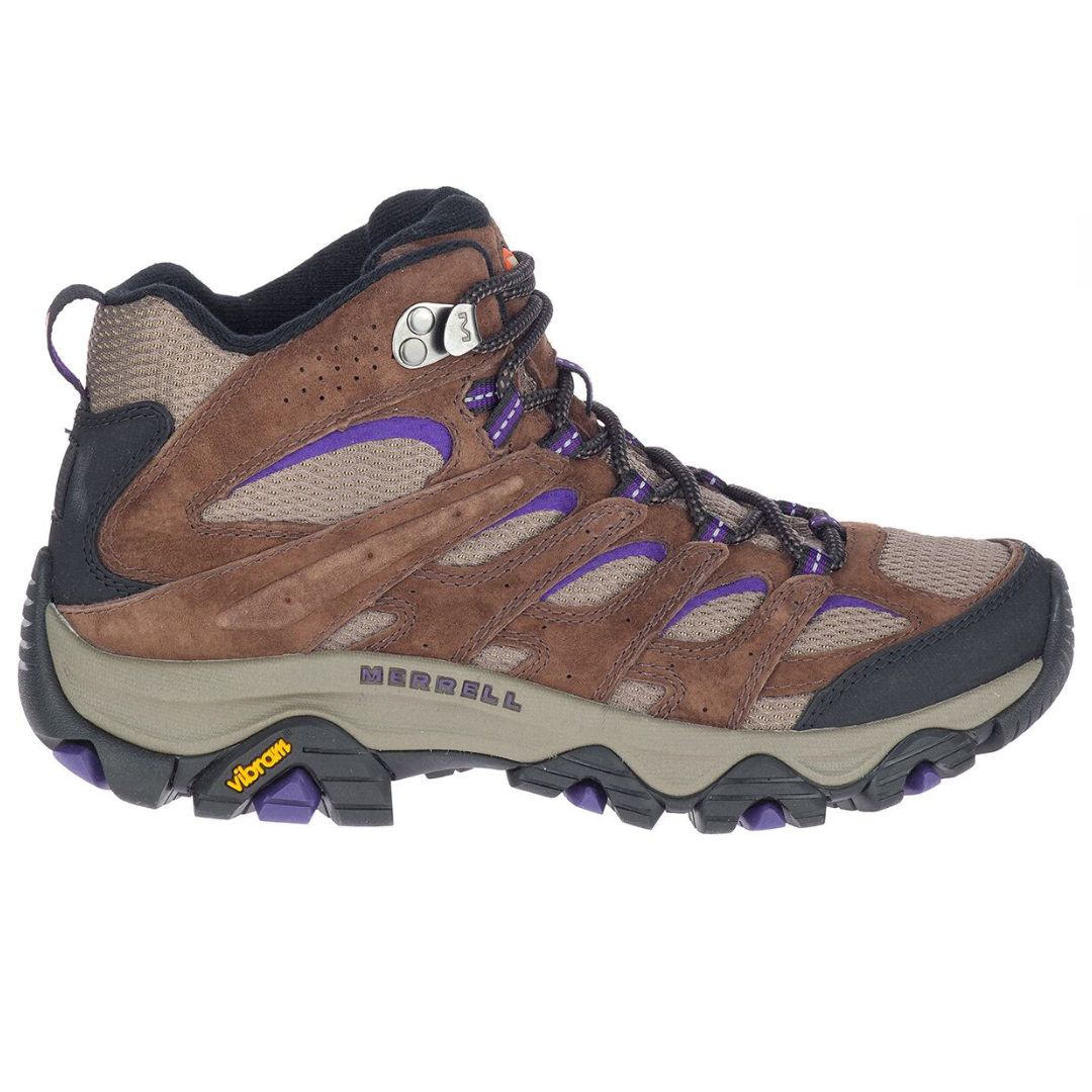 Merrell Moab 3 Hiking Boots feature brown suede and mesh uppers with purple accents, a durable Vibram sole, and metal lace hooks for stability and support on rugged terrain.