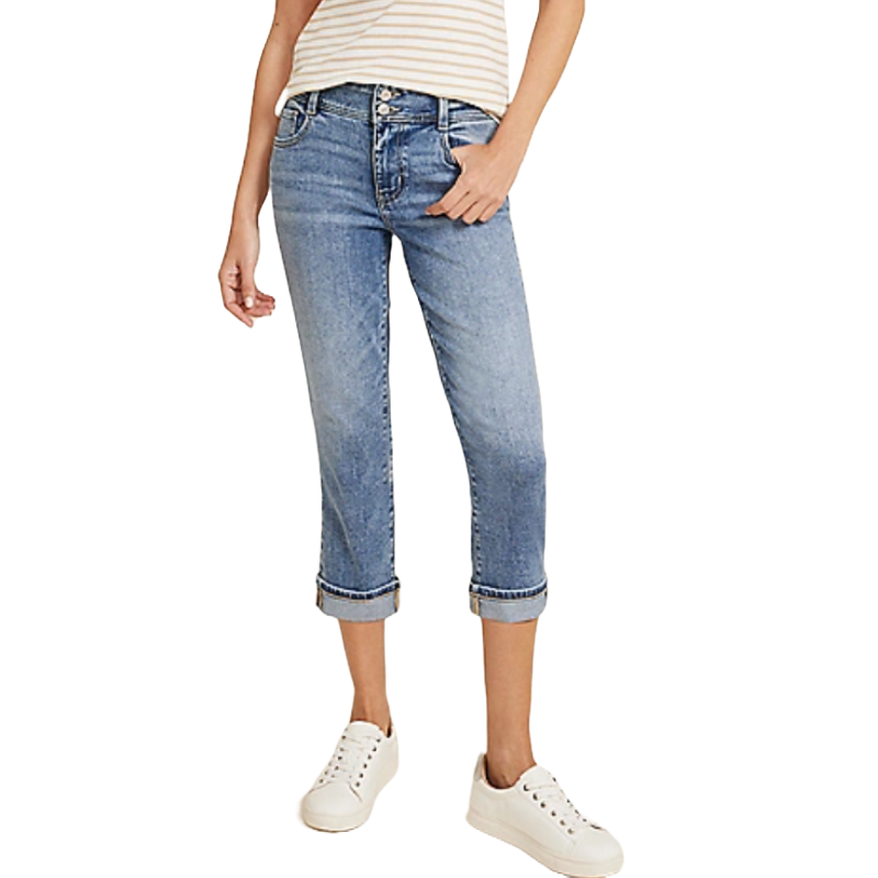 Classic Mid Rise Double Button Capri with a light blue wash, features cuffed hems, and has a casual fit. Paired with a striped top and white sneakers.