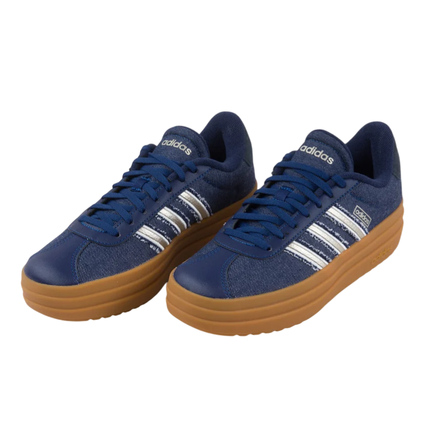 A pair of blue Adidas sneakers with white stripes and gum rubber soles.