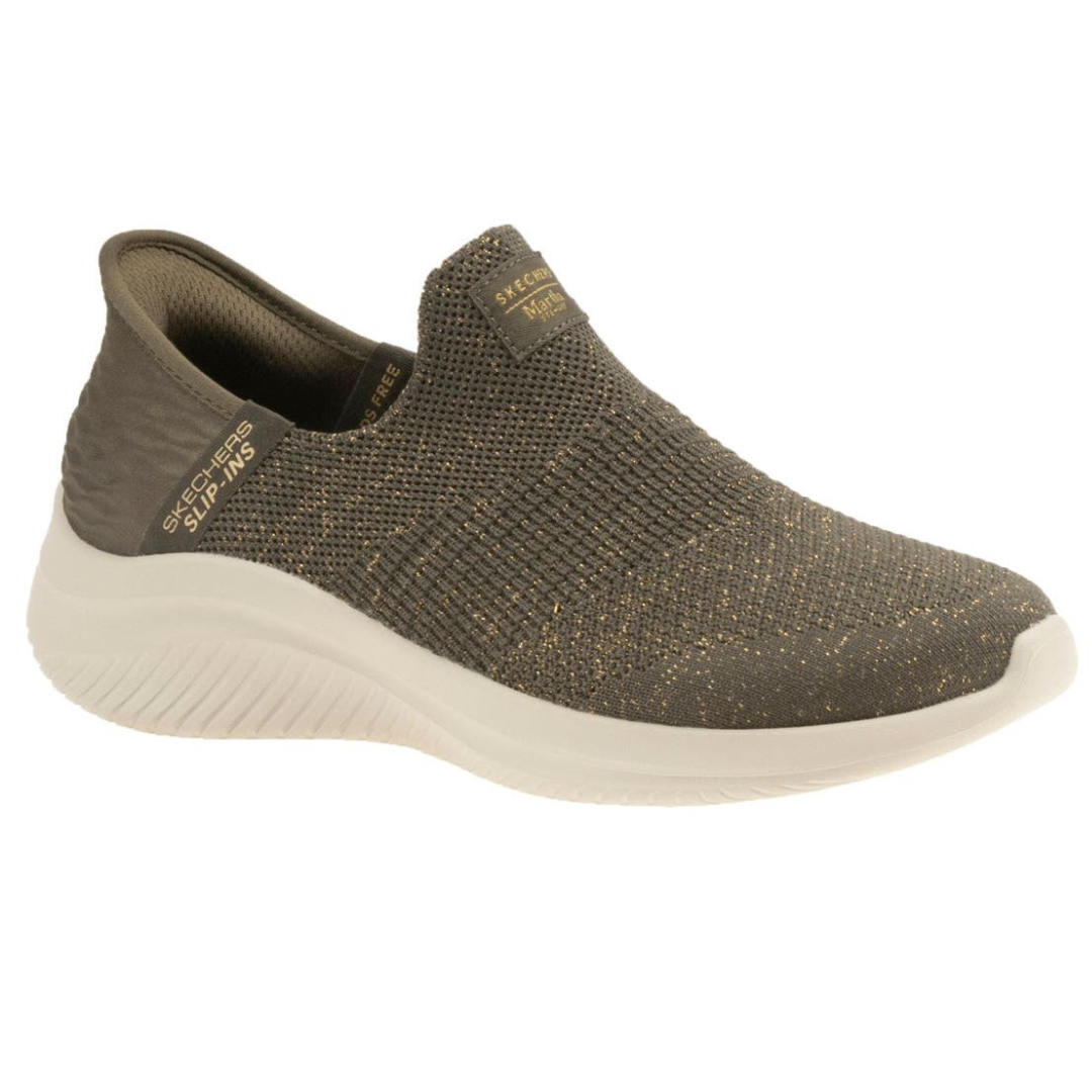 A Skechers slip-on shoe with a knitted upper in olive with gold speckles, featuring a white sole designed for comfort and convenience.
