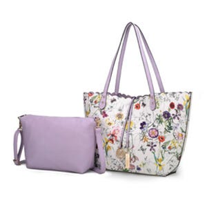A lavender reversible tote with floral patterns and matching crossbody bag featuring gold-tone accents and detachable straps, combining style and versatility for everyday use.