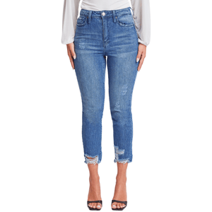 High-waisted blue skinny jeans with distressed detailing at the knees and hem, paired with black open-toed sandals.