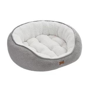 Gray and white plush pet bed with a textured exterior and a soft, padded interior, designed for comfort.