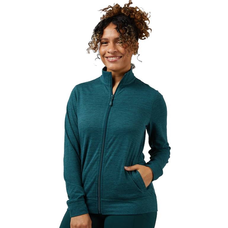 A person wearing a teal zip-up jacket with long sleeves and pockets.