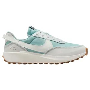 A light blue and white sneaker with a sleek design, featuring a white swoosh, white laces, gray suede accents, and a white midsole with a gum-colored outsole.