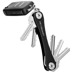 A compact key holder with a black aluminum frame that organizes several keys in a foldable, Swiss army knife style; includes an attachment loop for a larger keychain or car remote.