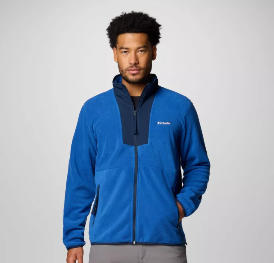 A man wearing a blue Columbia fleece jacket with a half-zip front and contrasting gray accents.