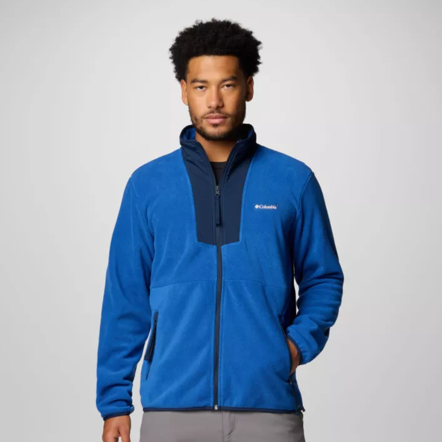 A man wearing a blue Columbia fleece jacket with a half-zip front and contrasting gray accents.