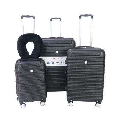 Three black hard-shell suitcases of varying sizes, each with four wheels and telescopic handles. A black neck pillow is draped over the smallest suitcase.