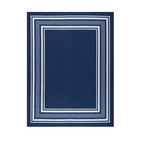 Navy blue rug with a rectangular geometric pattern featuring multiple white-bordered squares.