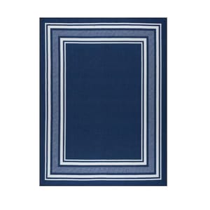 Navy blue rug with a rectangular geometric pattern featuring multiple white-bordered squares.